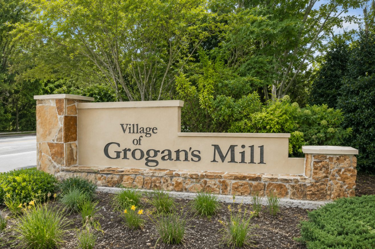 Village of Grogan's Mill monument sign with stone pillars