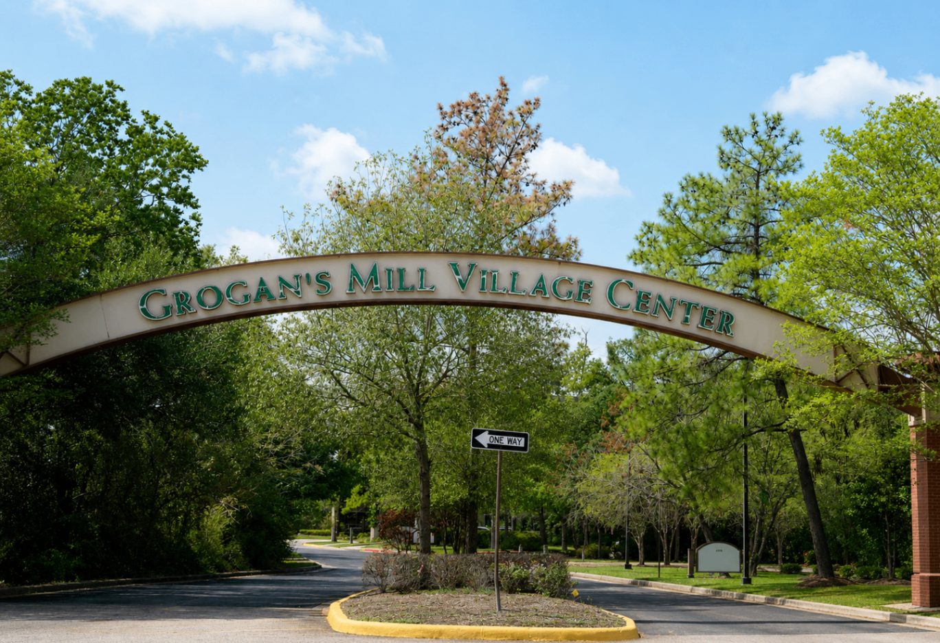 Archway sign at the entrance to Grogan's Mill Village Center